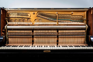 Interior of upright piano showing difference between interior of upright vs. interior of grand piano